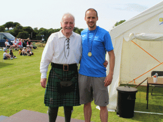 Games President presents medal to Allan Hamilton